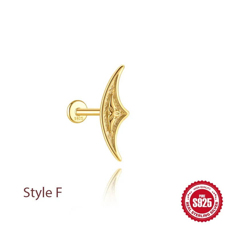 A gold crescent moon-shaped stud earring with an engraved tribal-style pattern, shown from a side profile view on a white background with a reflection. The text 'Style F' is printed in dark red on the bottom left, and a red 'S925 Pure Sterling Silver' quality seal is in the bottom right corner.