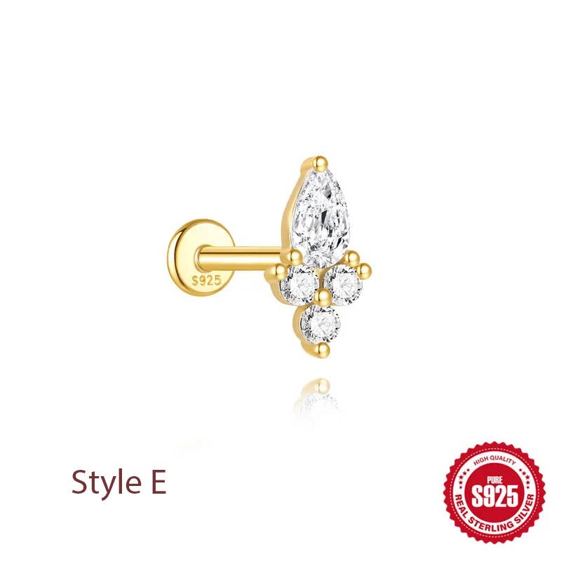 A gold-plated labret stud earring with a teardrop-shaped cluster of clear gemstones, featuring a small round stone and a larger marquise-cut stone, shown on a white background with 'Style E' text and an S925 sterling silver seal.
